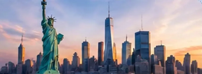 New York skyline with the Statue of Liberty at sunset